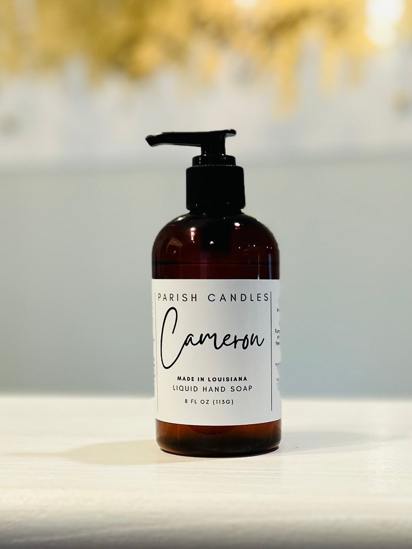 Parish Candles Liquid Hand Soap in the scent “Cameron” on a white label, 8 ounces in a brown bottle