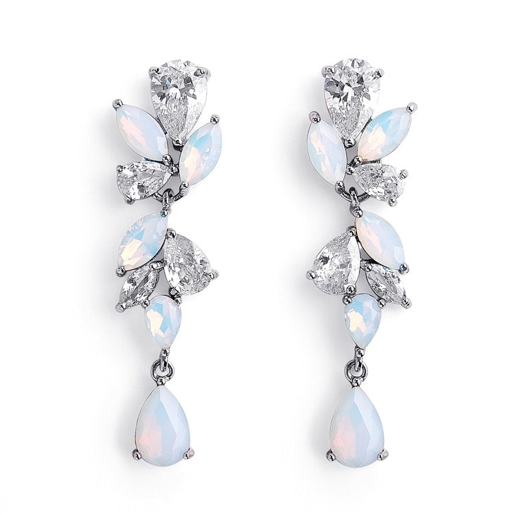 A pair of opal and cubic zirconia earrings with marquis and tear drop shaped stones, in silver tone metal.