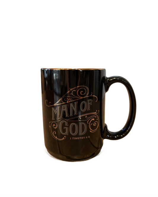 Black mug with 'Man of God' text on a white background