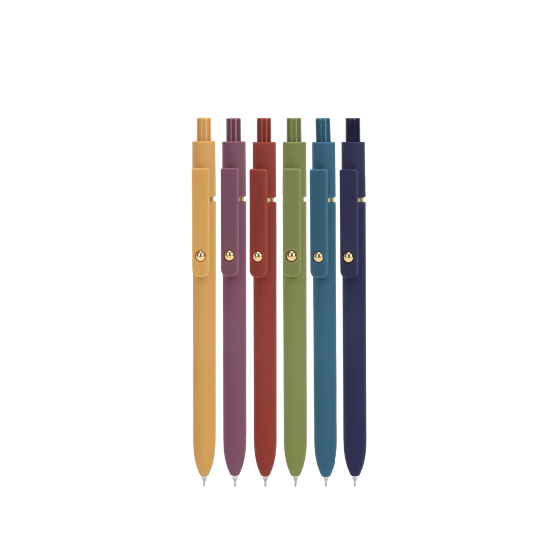 Set of five pens in different colors on a white background