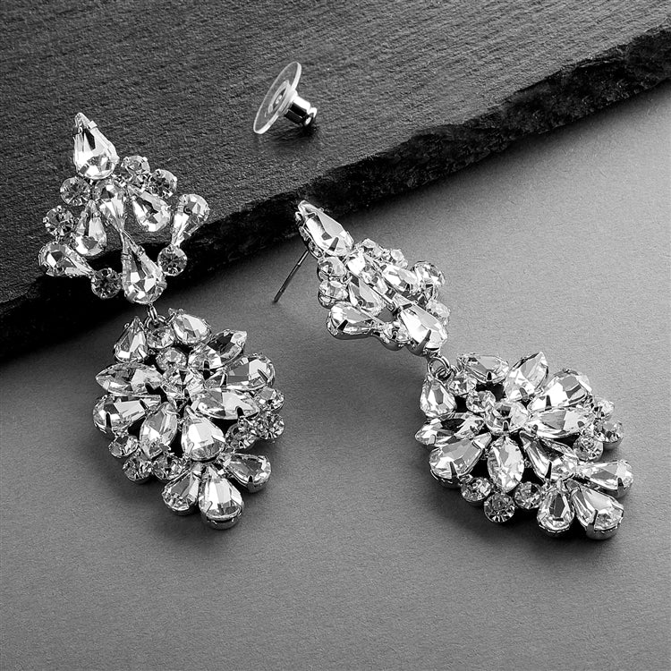 A pair of silver-colored bridal earrings with a vintage modern style, featuring a floral pattern with Austrian crystals.