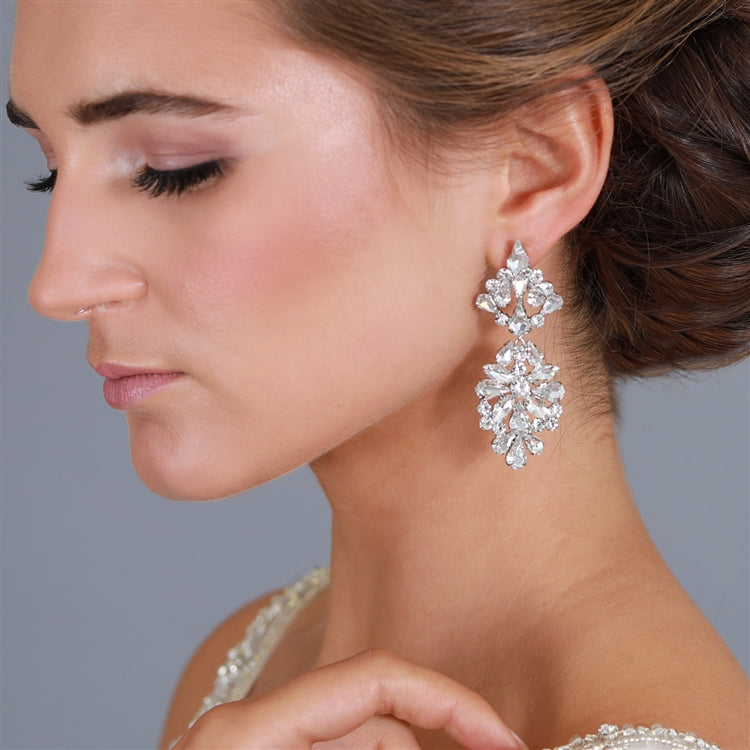 A pair of silver-colored bridal earrings with a vintage modern style, featuring a floral pattern with Austrian crystals.