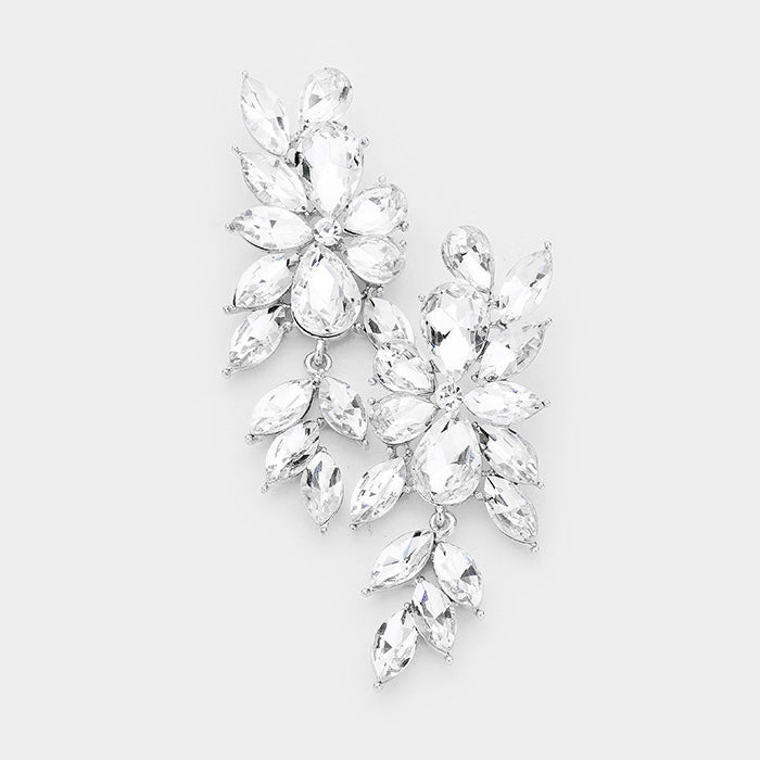 A pair of silver colored marquis shaped rhinestone dangle earrings.