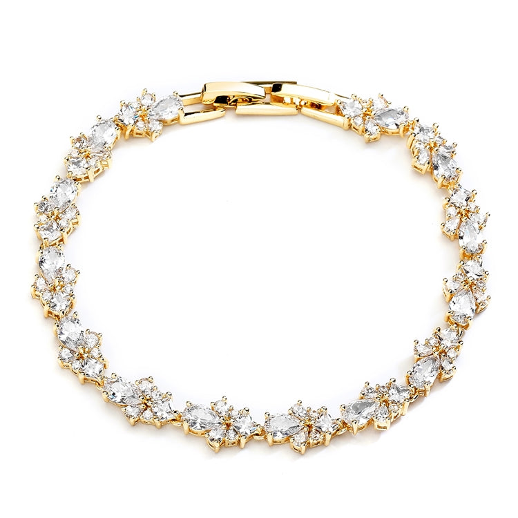 Gold bracelet with small teardrop and round cubic zirconia stones.