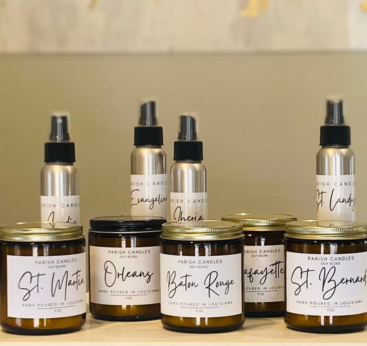 A collection of candle and room spray sets, each labeled with different place names such as 'St. Martin' and 'Baton Rouge'.