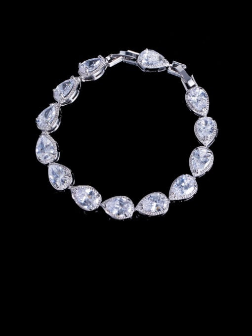 Silver rhinestone bracelet with teardrop shaped rhinestones on a black background l.
