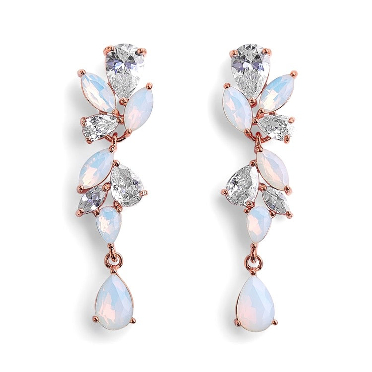 A pair of opal and cubic zirconia earrings with marquis and tear drop shaped stones, in rose gold tone metal.