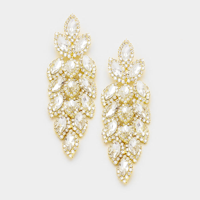Marquis earrings in gold metal and clear stones.